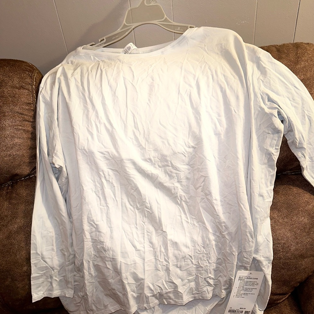 NWT Lululemon Back in action long sleeve Nulu top, size 12… ivory color